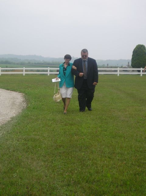 Faye Brown walking with Funeral Director, Keith Awalt