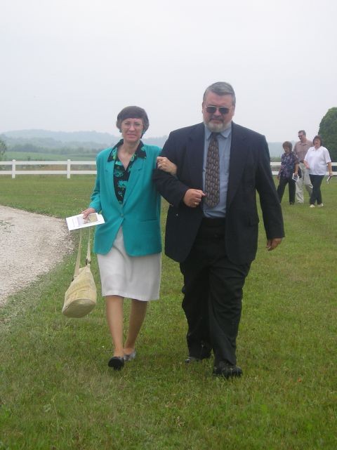 Faye Brown walking with Funeral Director, Keith Awalt